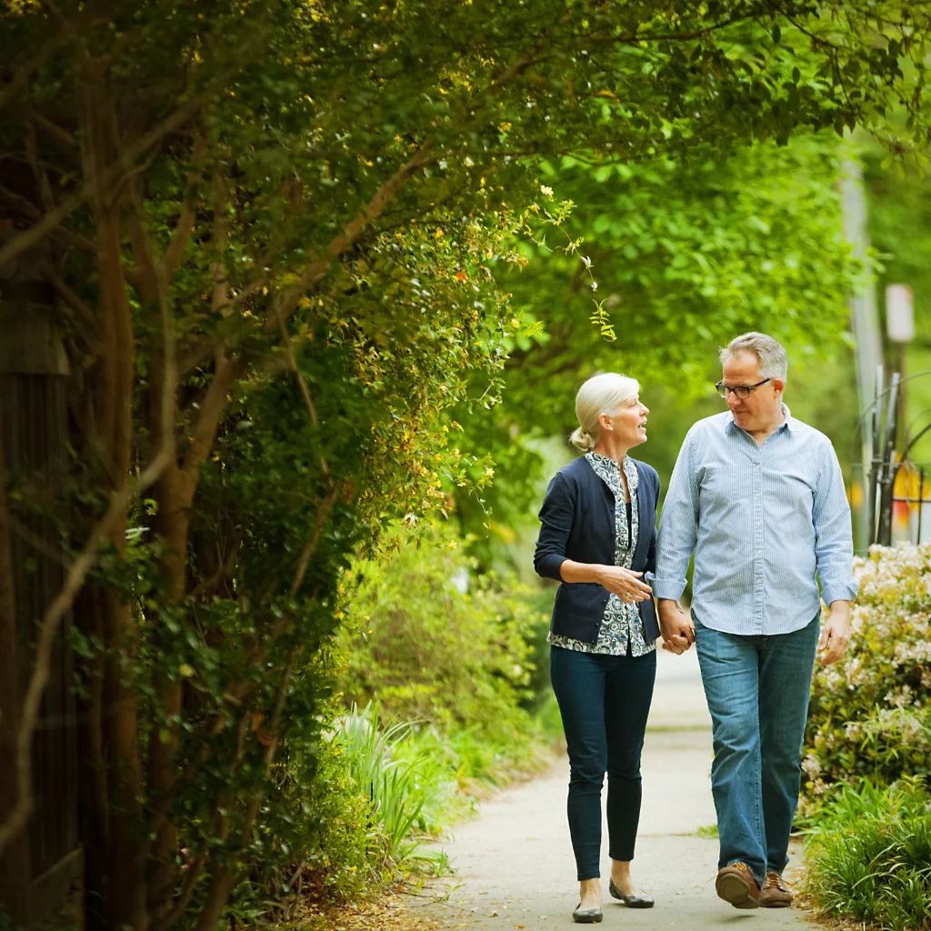 A couple walking comfortably outdoors
