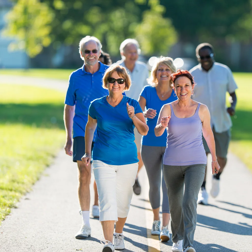 A group of active adults walking comfortably outdoors